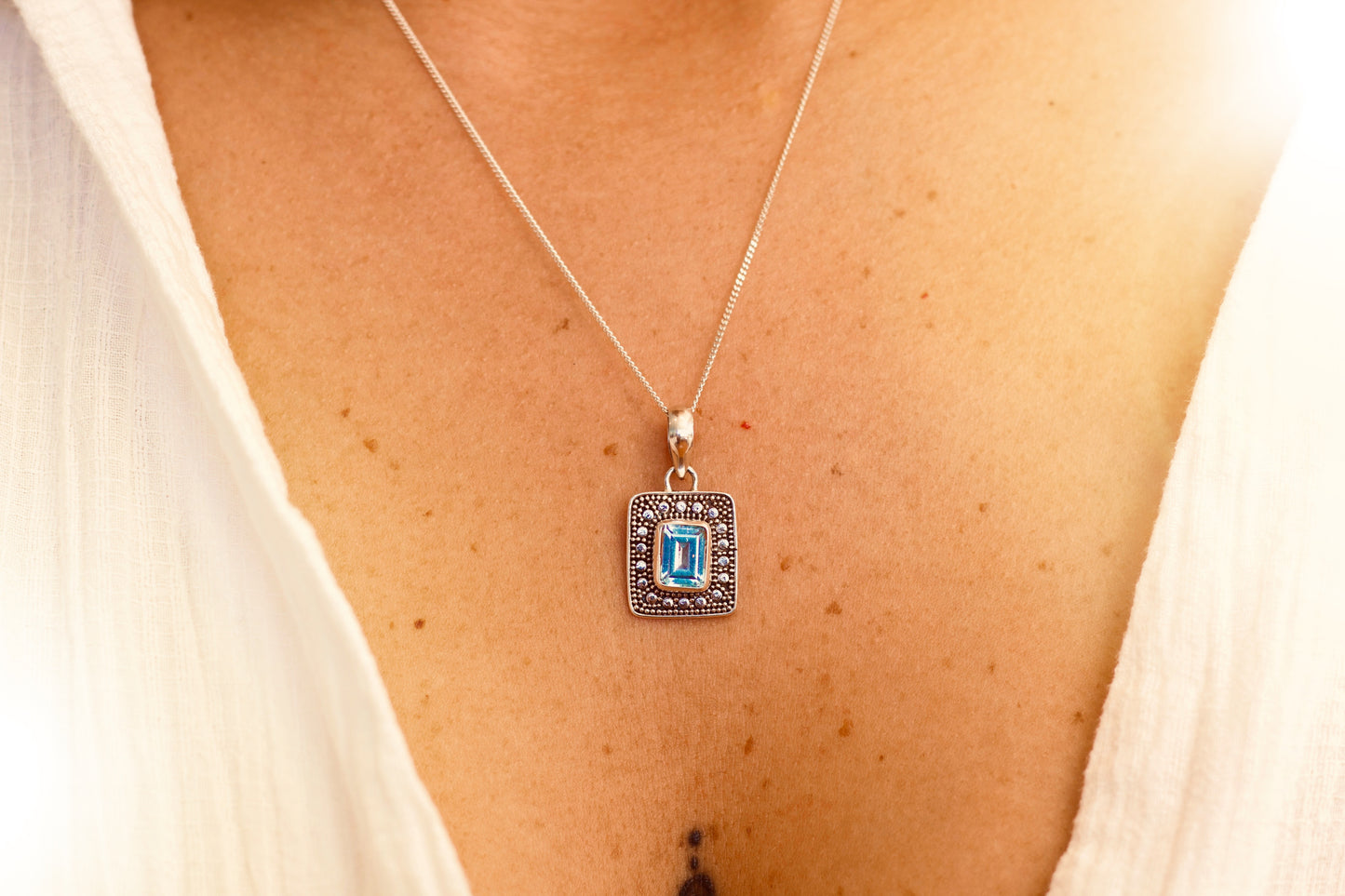 Infinite blue topaz necklace